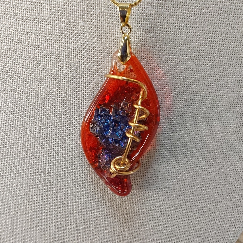 Necklace with brass. Bismuth metal. on resin
